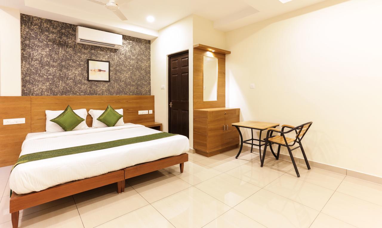 Treebo Trend Cmks Gulmohar Suites Kochi Exterior foto