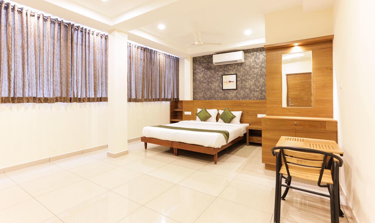 Treebo Trend Cmks Gulmohar Suites Kochi Exterior foto