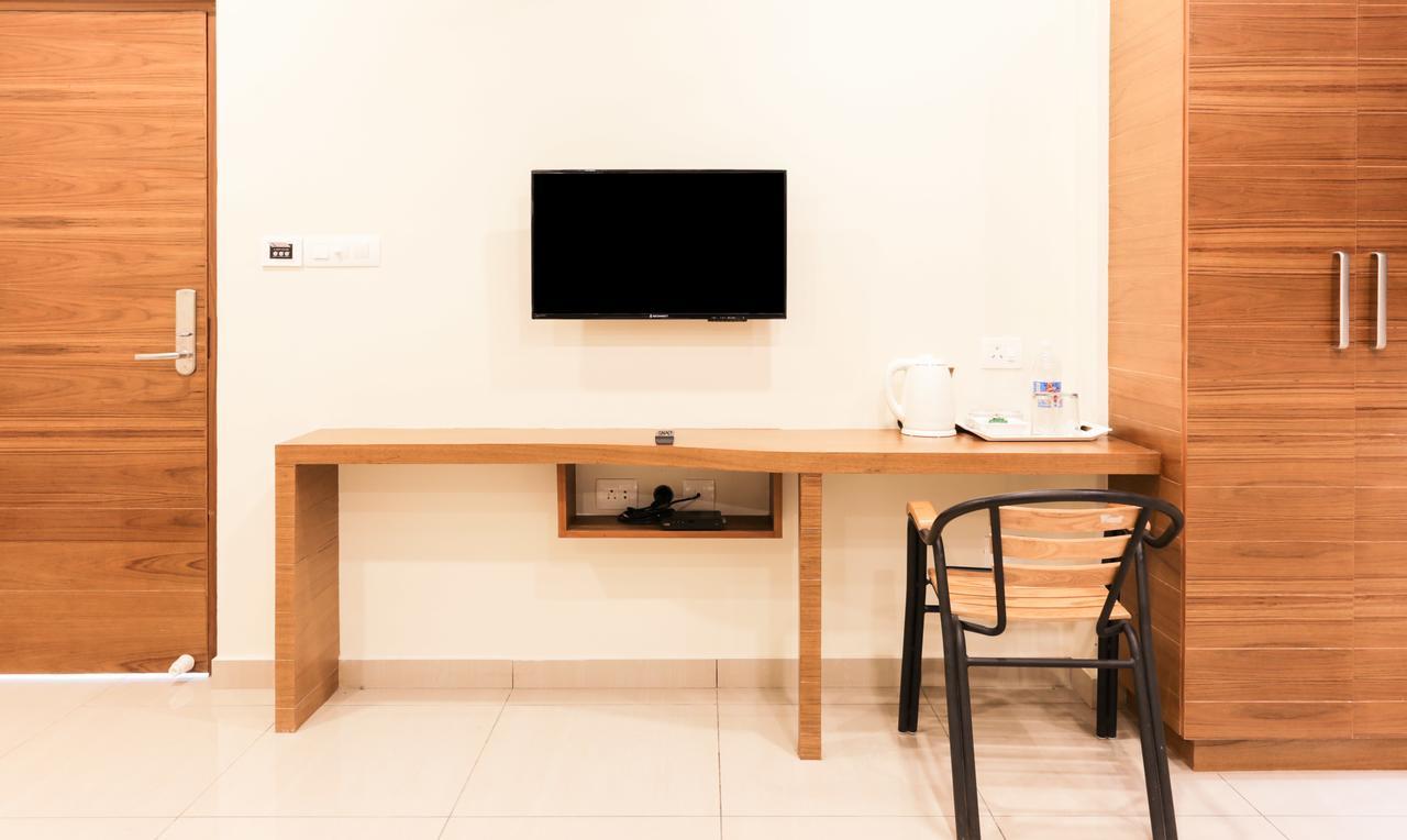 Treebo Trend Cmks Gulmohar Suites Kochi Exterior foto
