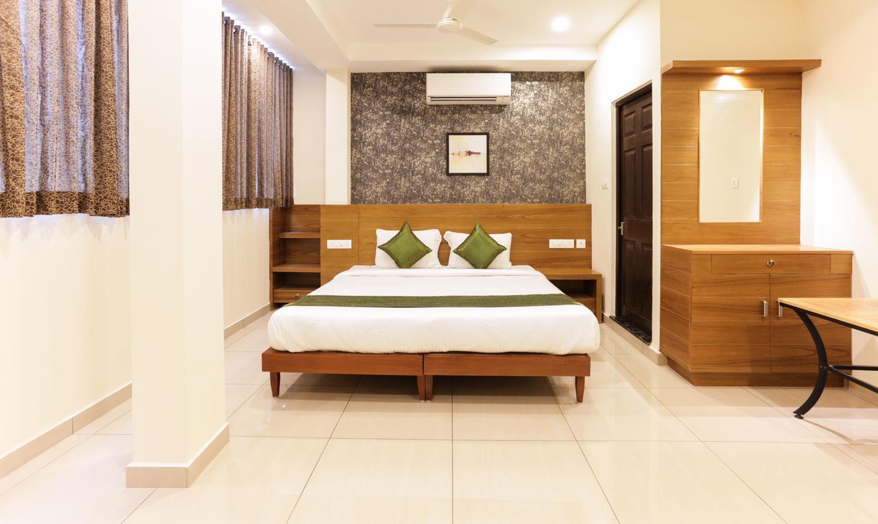Treebo Trend Cmks Gulmohar Suites Kochi Exterior foto